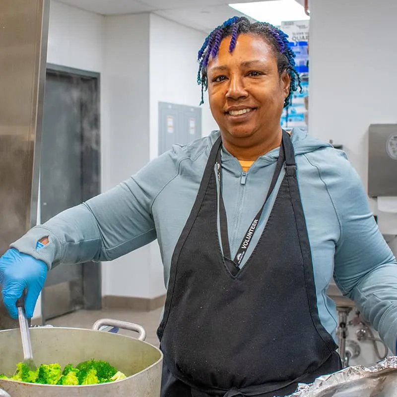 volunteer in Bridge Housing Campus kitchen