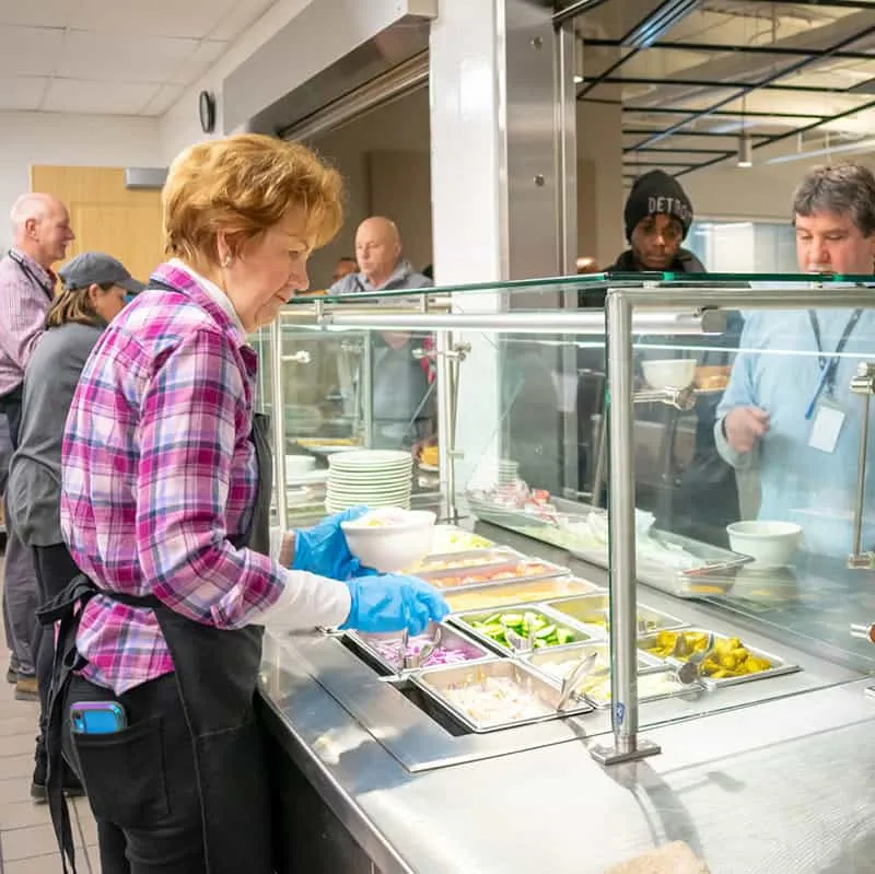 kitchen volunteer at bridge housing campus