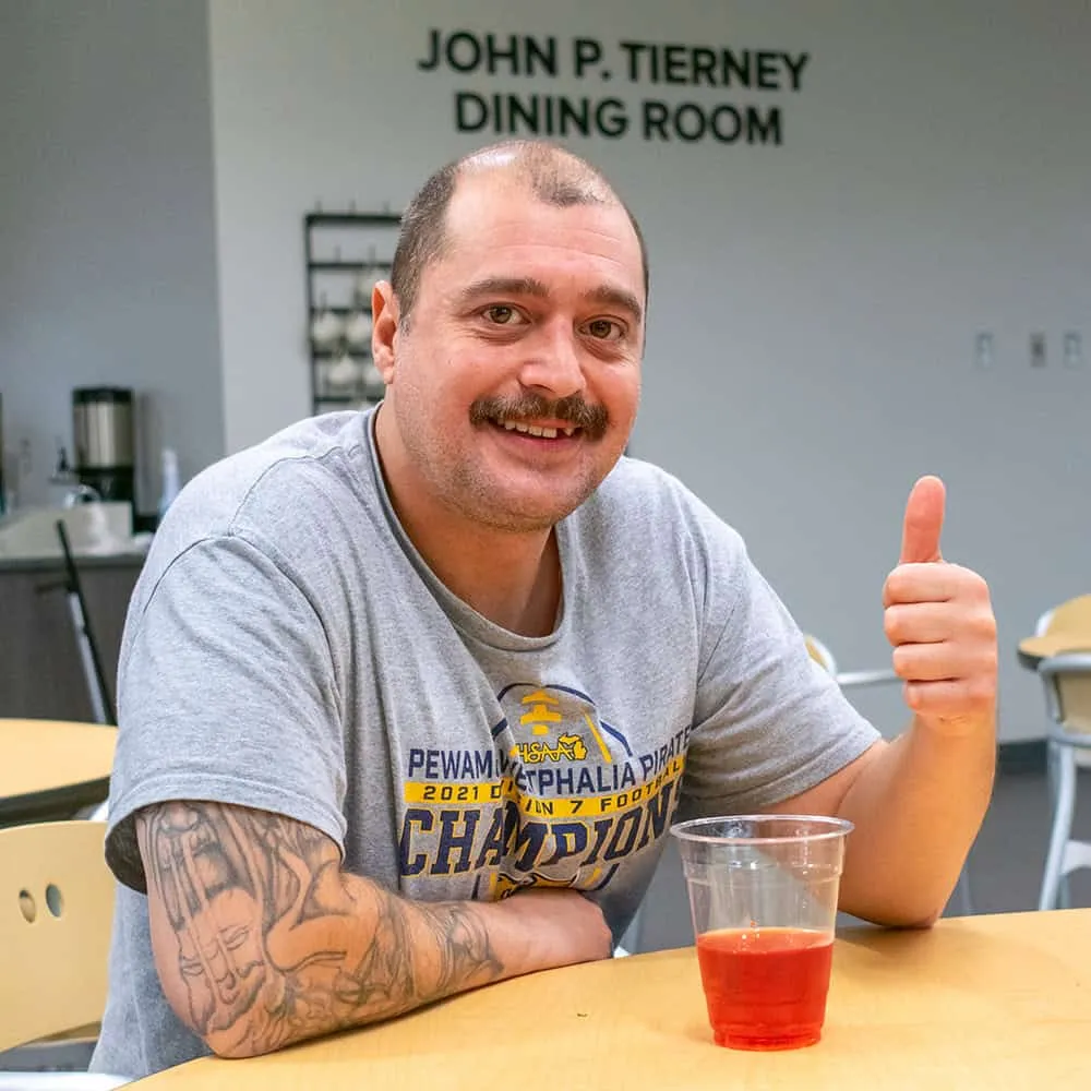 Bridge Housing Campus guest in dining room
