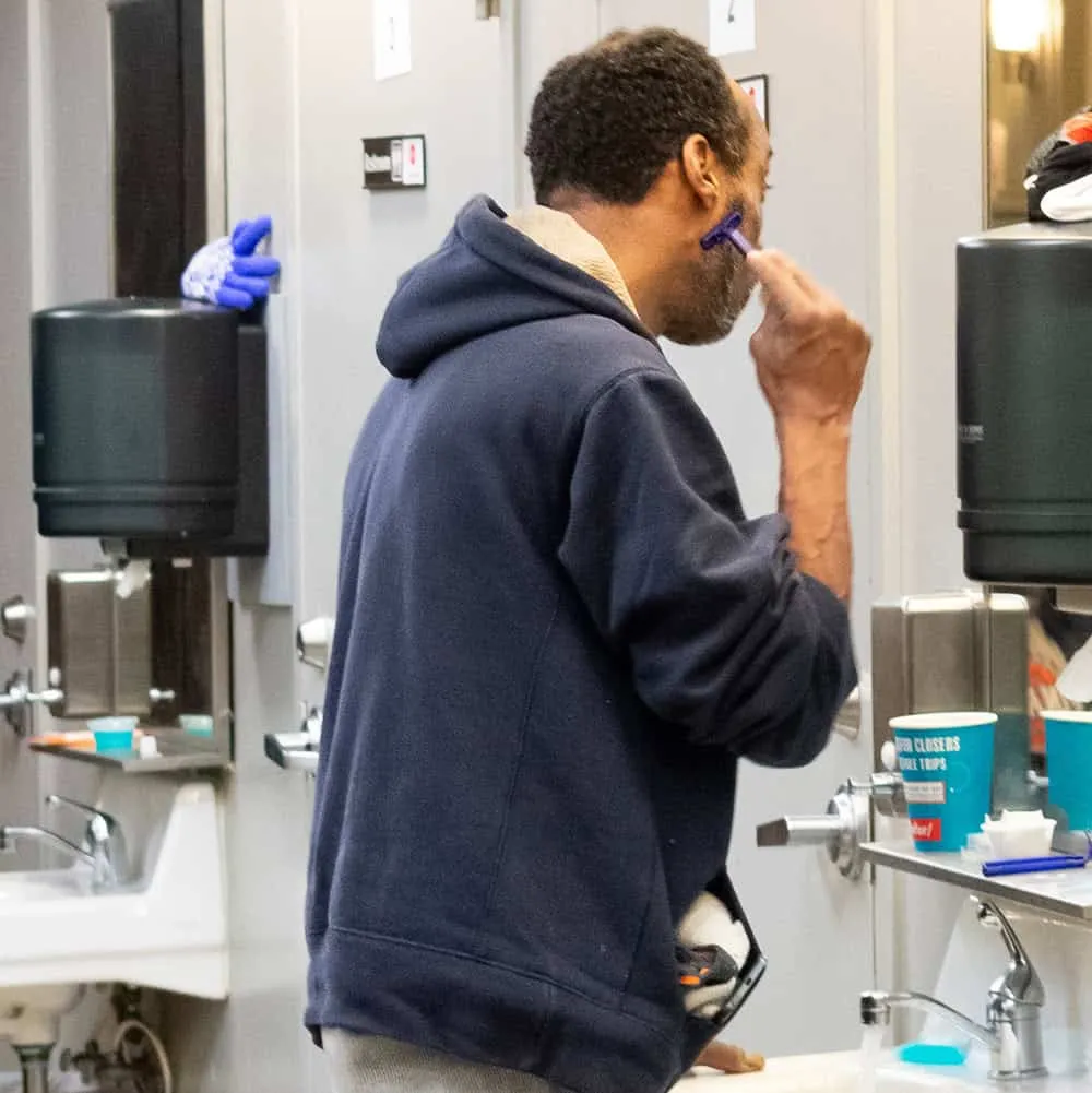 guest shaving at day center