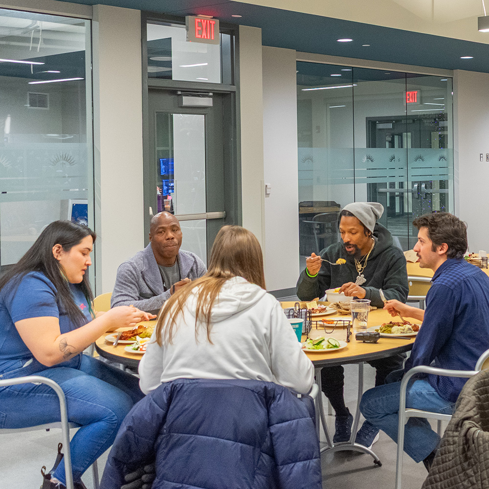 guests eating at BHC Guests eating at Bridge Housing Campus