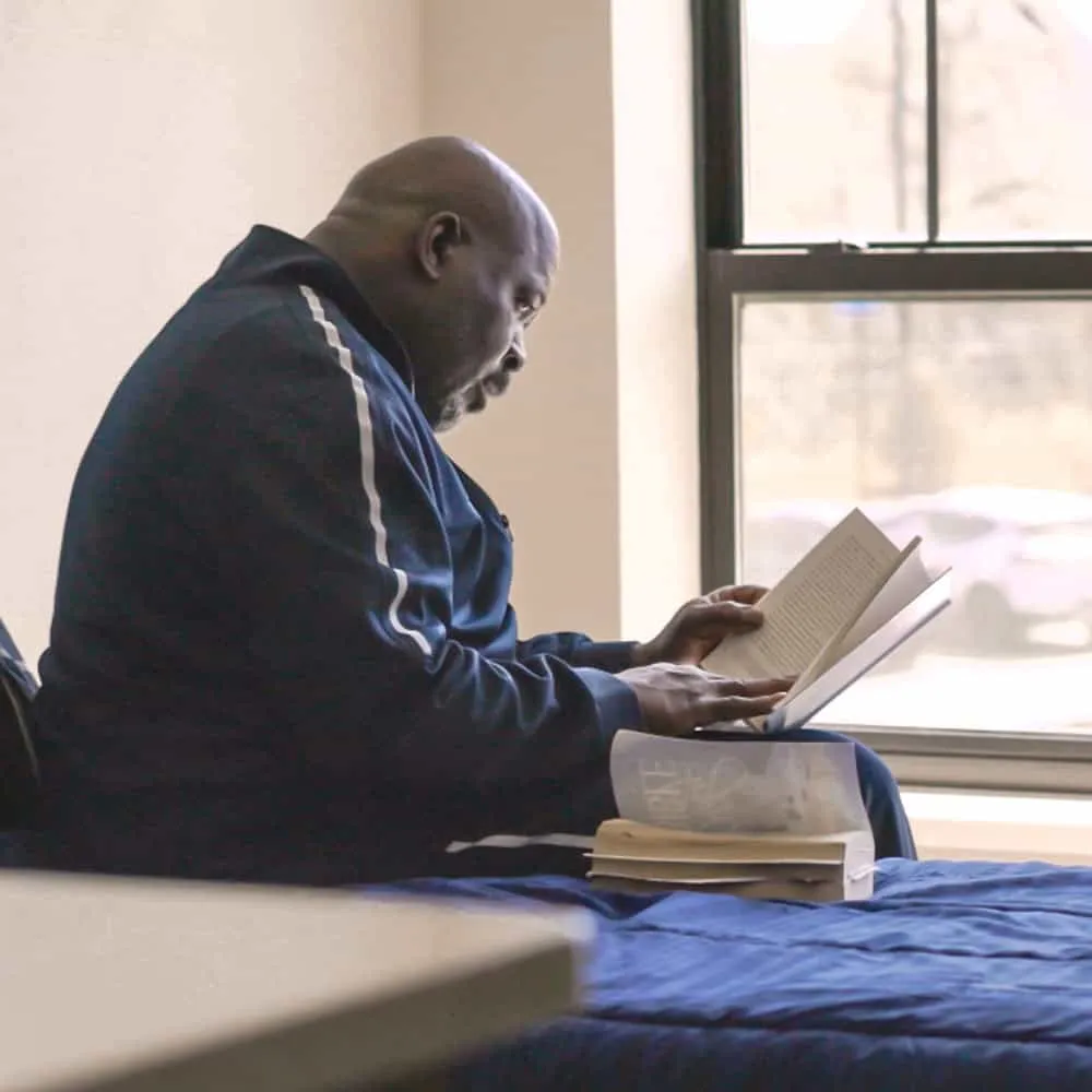 BHC guest reading a book