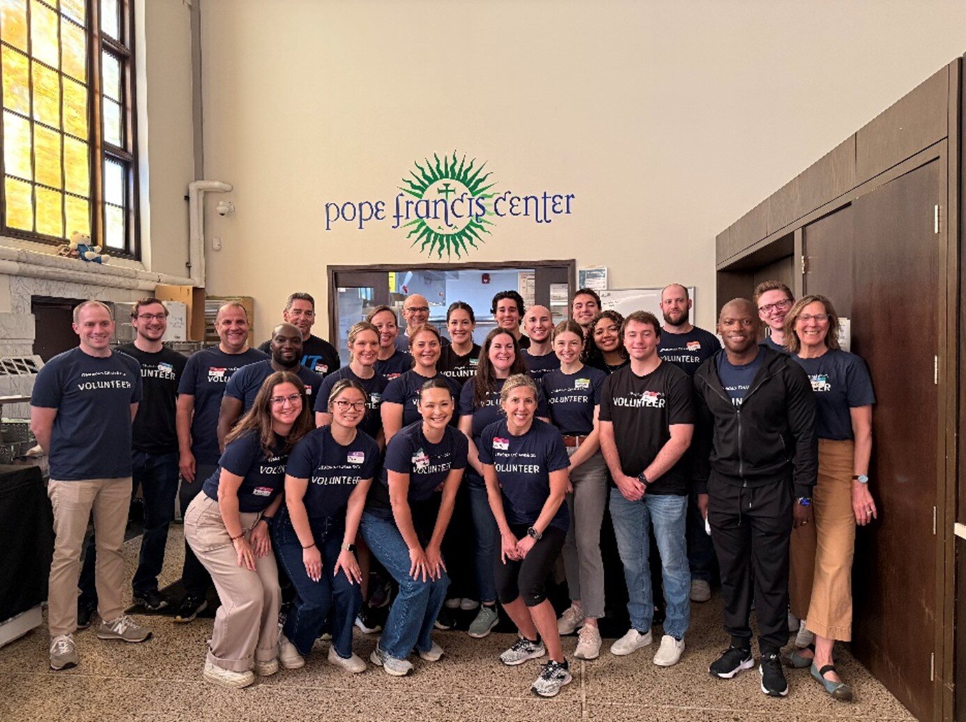 Volunteers from JPMorgan Chase gather at the PFC Day Center